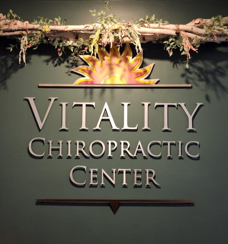 Vitality Chiropractic Center in Bellevue, WA Front Desk Reception Sign
